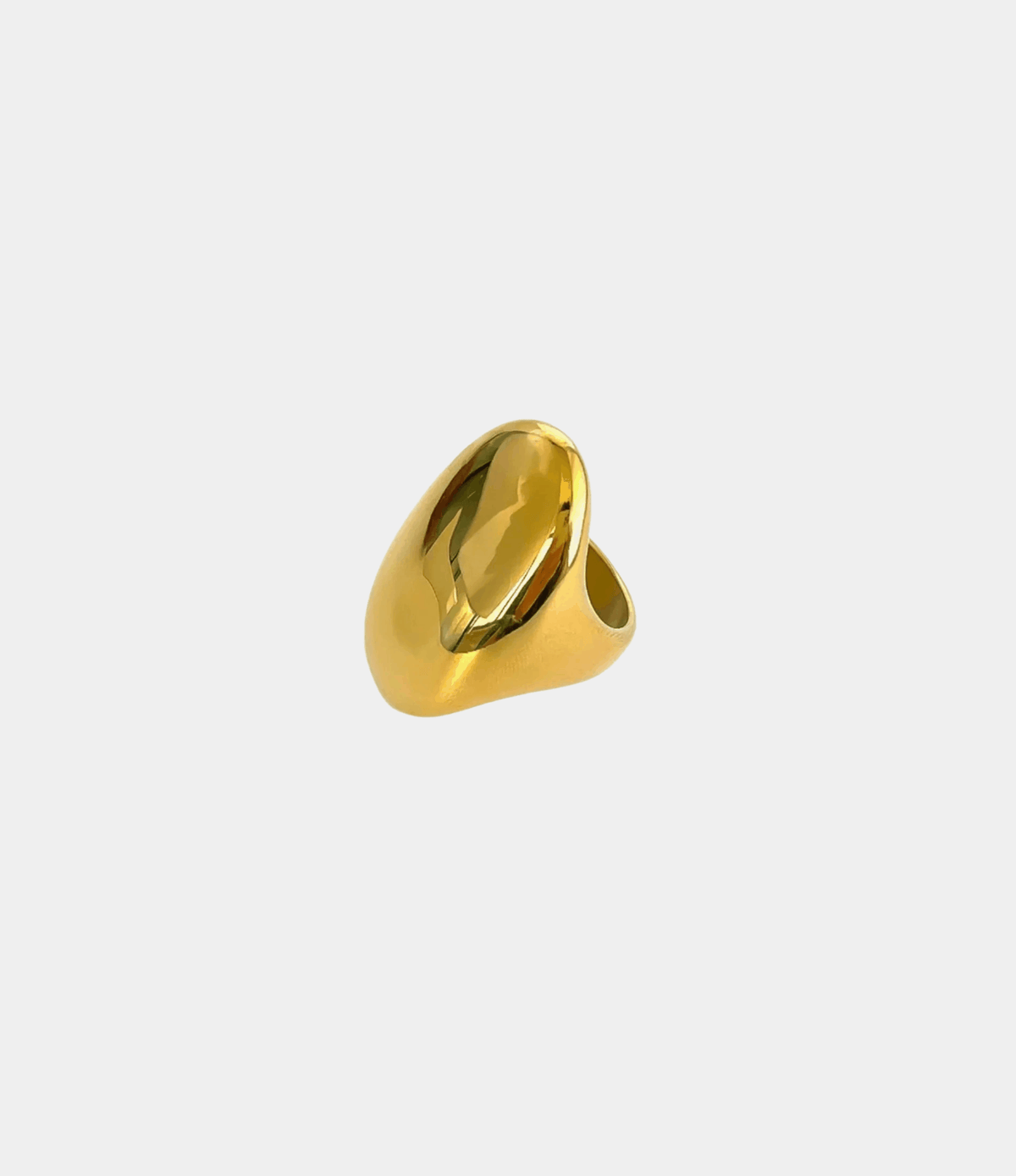 SAVOY SOIREE RING, a gold-tone statement ring with a sculptural band and large faceted oval stone.