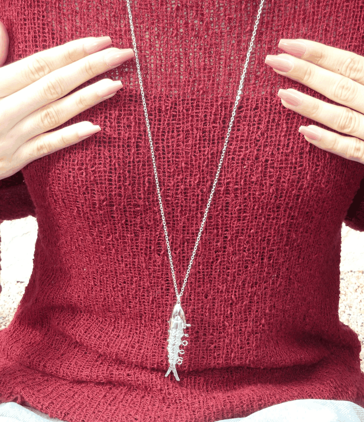 FIONA FISH NECKLACE with a fine silver-tone chain and slender fish pendant featuring sparkling clear accents