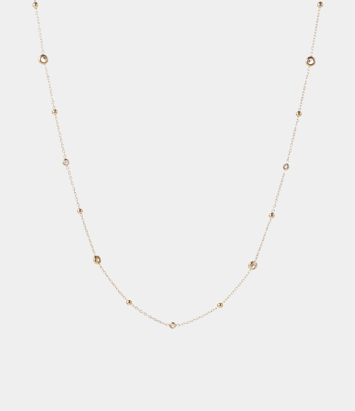 ANGELINA WAIST CHAIN in gold-tone metal, with a delicate fine chain and evenly spaced clear round stones.