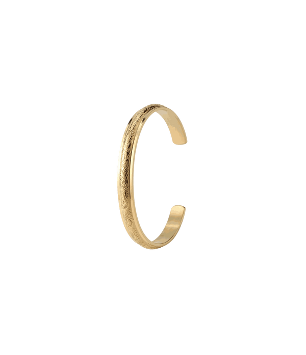 Open cuff bangle in gold-tone metal with fine engraved detailing and a sculptural shape; Adeline Bangle - Stainless steel bangle.