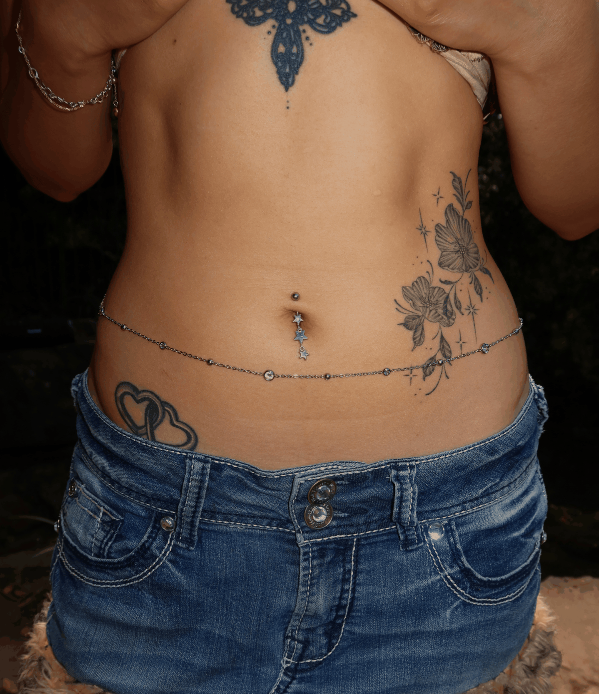 Waist chain with fine silver-tone links and pink zirconia accents; Angelina Waist Chain - PVD plated stainless steel and pink zirconia.