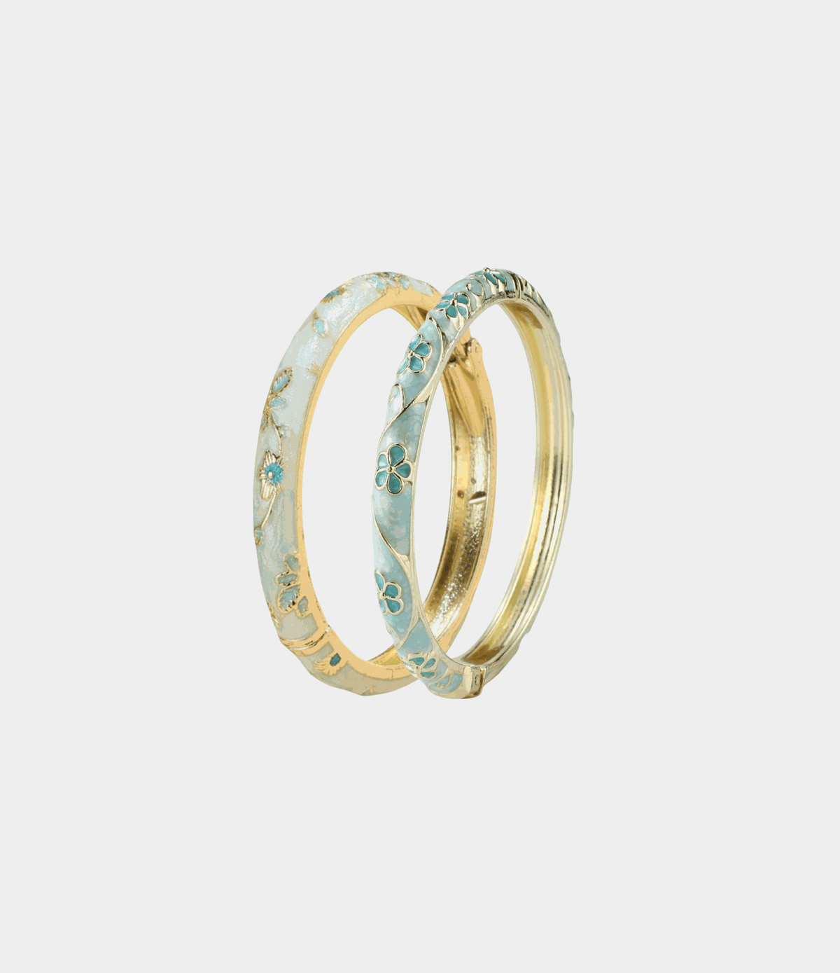 BLUE MONDAY BANGLE SET of gold-tone bangles with pale blue enamel and floral detailing, including a slim plain gold bangle.