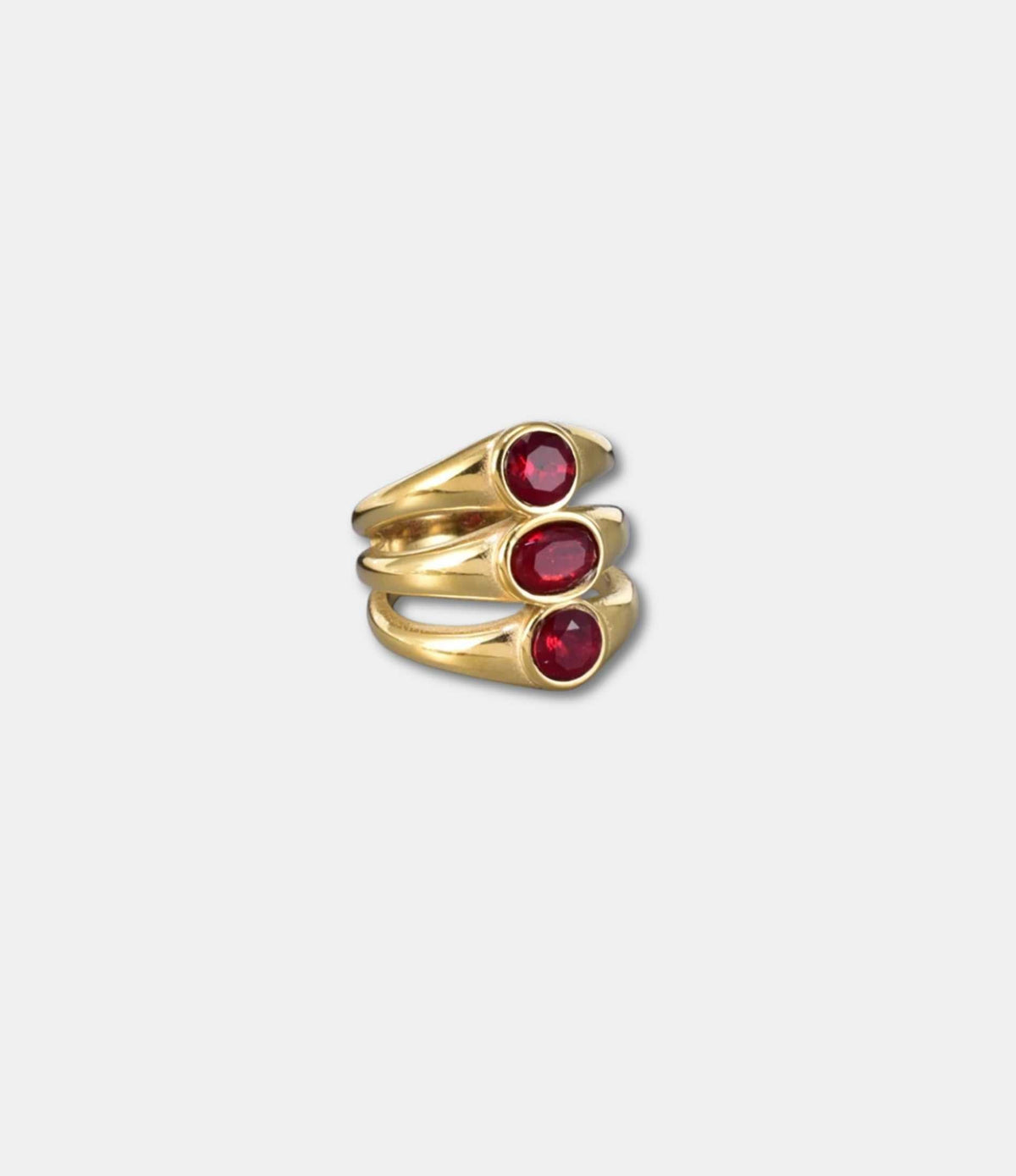 Crimson Martini Ring, gold-tone triple-stacked band with three deep red oval stones in bezel settings.
