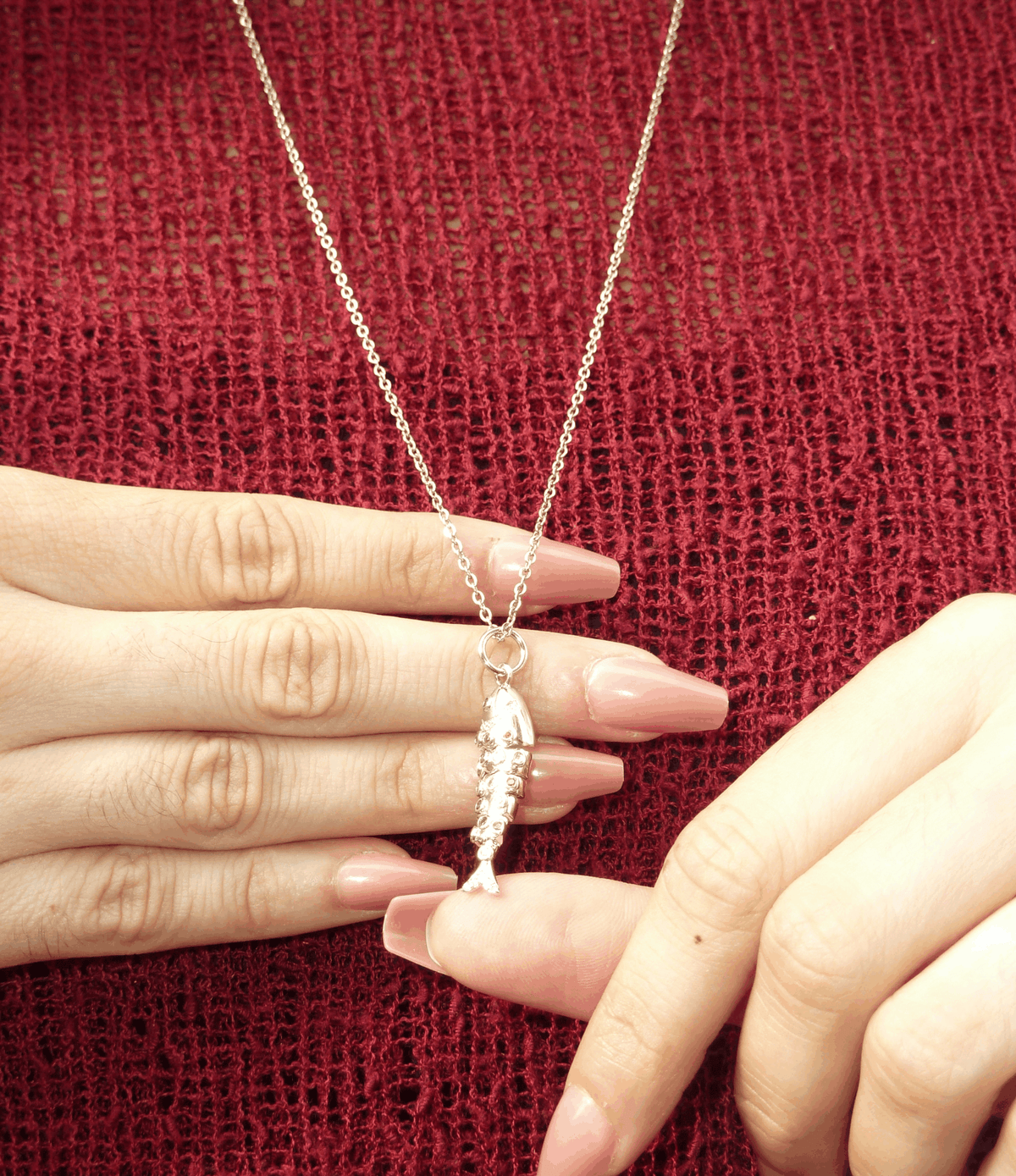 Lola Fish Necklace - Long chain made for layering, featuring a gold-tone chain and textured fish pendant
