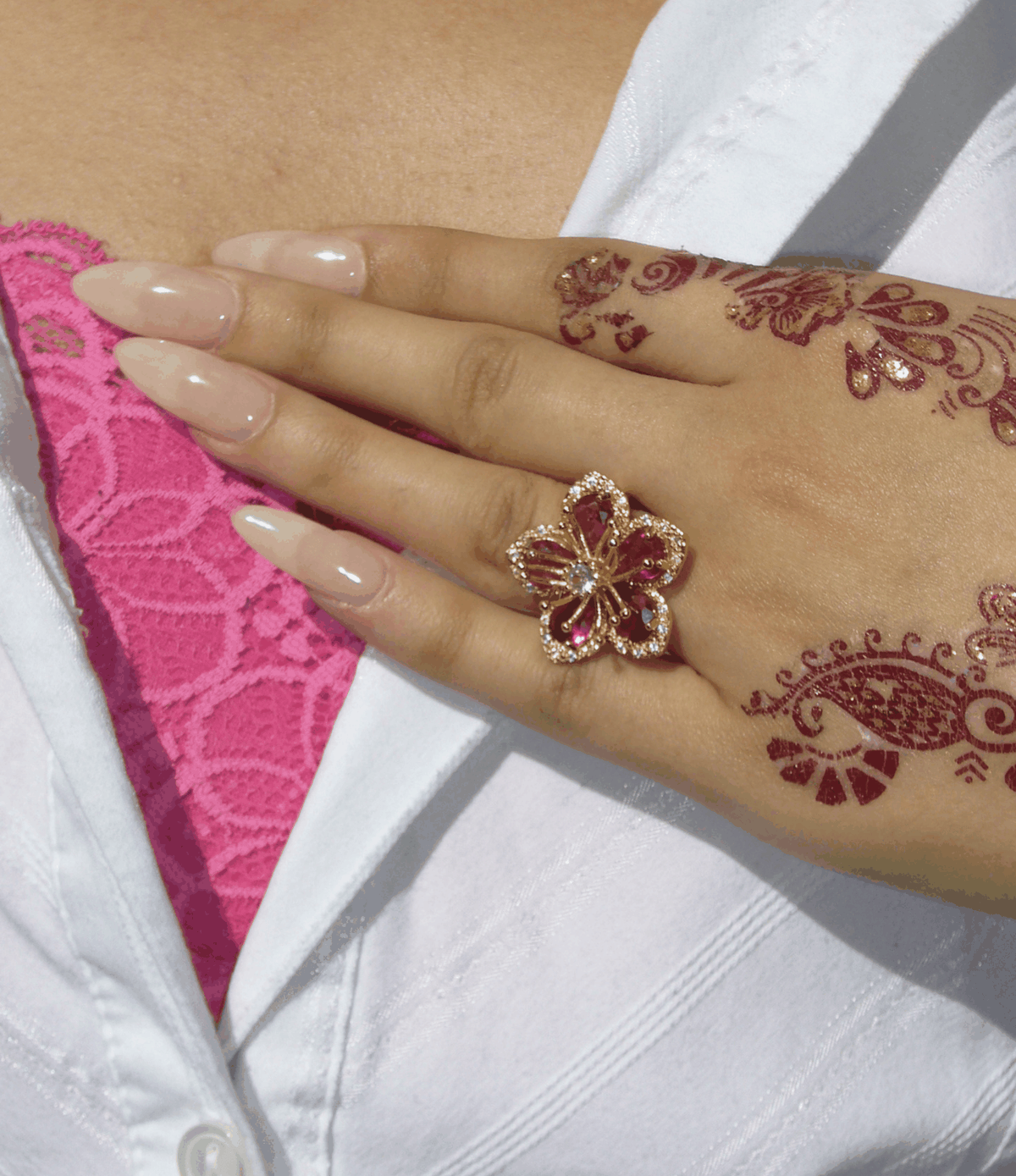 Lovela Ring in Red, gold-toned statement ring with a red and clear-stone flower design and ornate petals