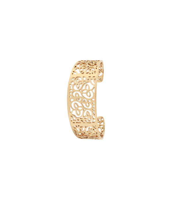 MAGNOLIA BANGLE gold-tone metal cuff with an openwork floral pattern and a wide, curved shape