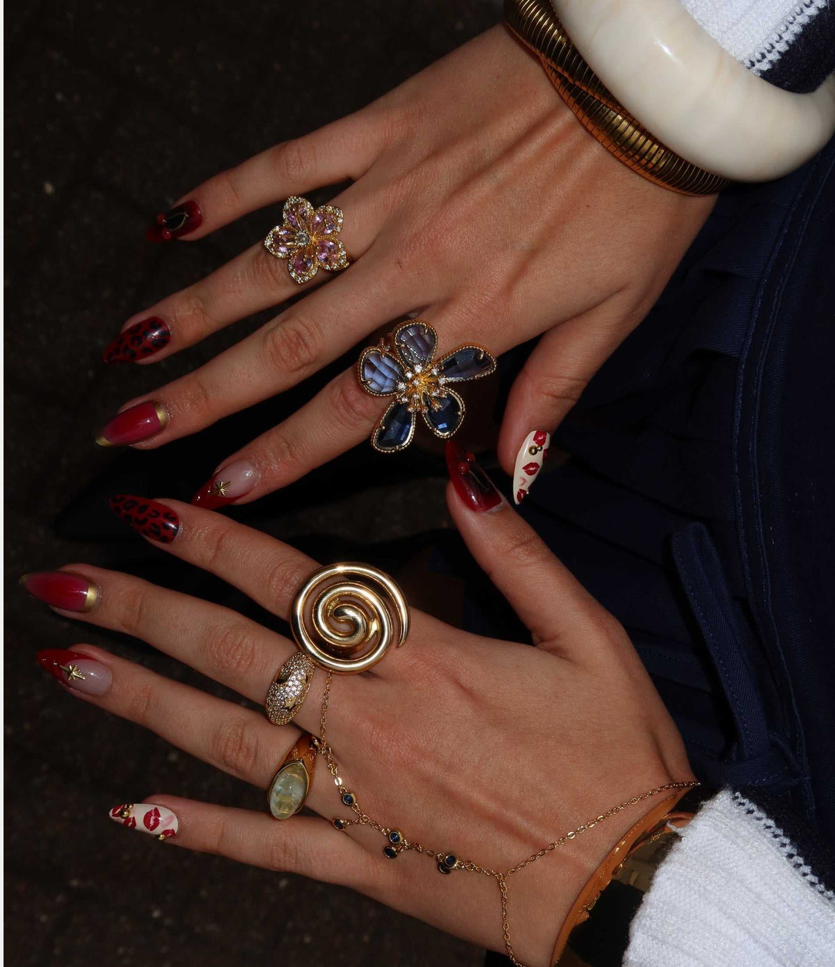 Molly Ring XL is a gold-tone statement ring with a bold, oversized spiral swirl design and polished finish.