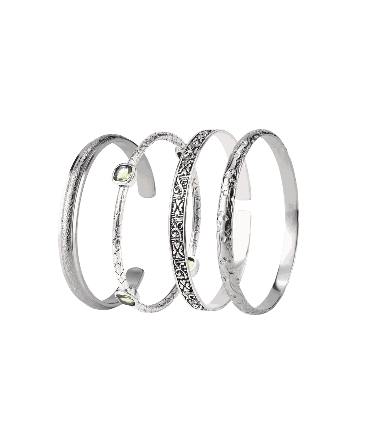 MOON BANGLE SET of four silver-tone metal bangles, with smooth, engraved and textured designs and a pale green stone.