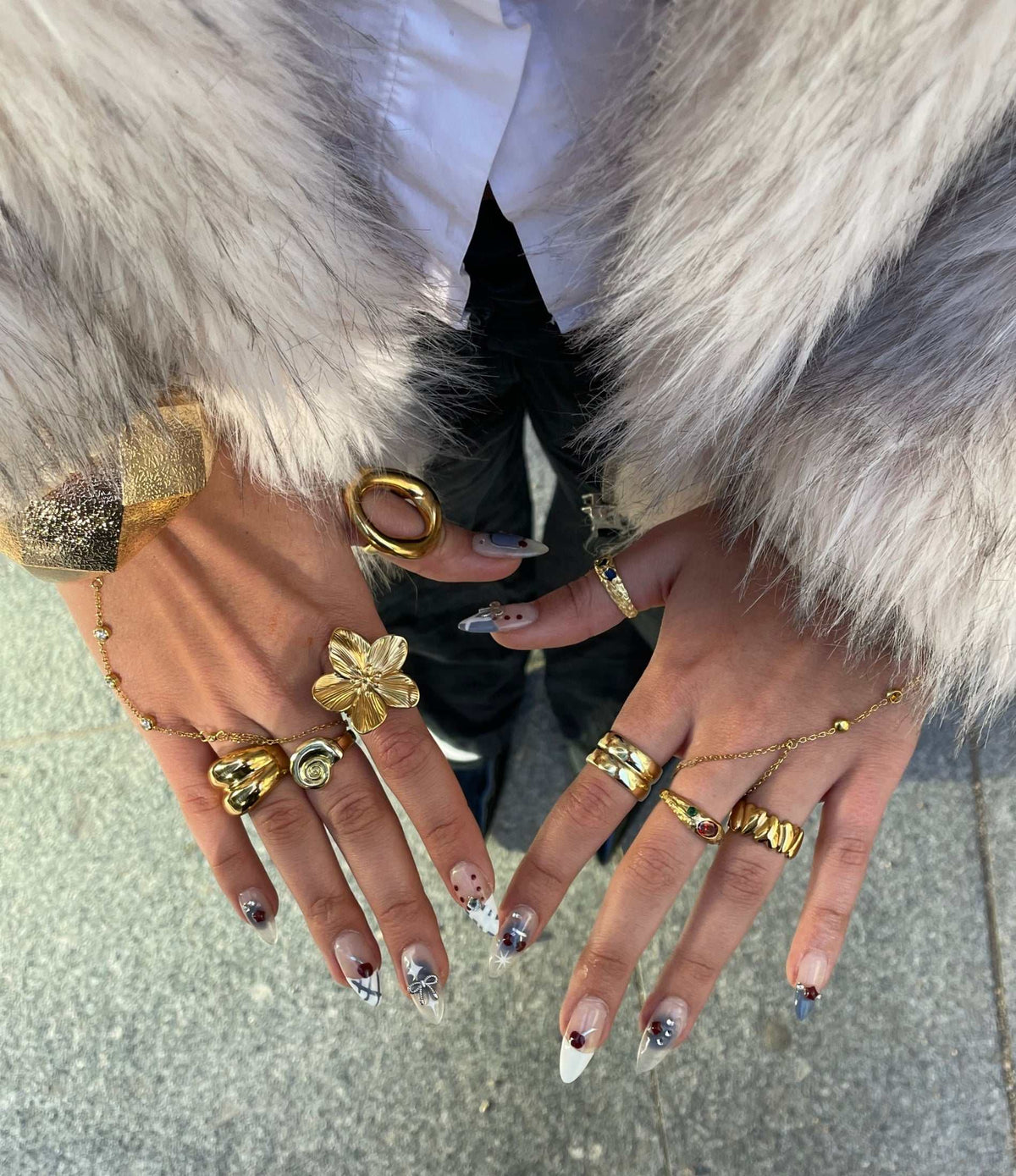 Orchid Affair Ring in gold-tone metal, with a sculptural five-petal flower and raised, textured details.