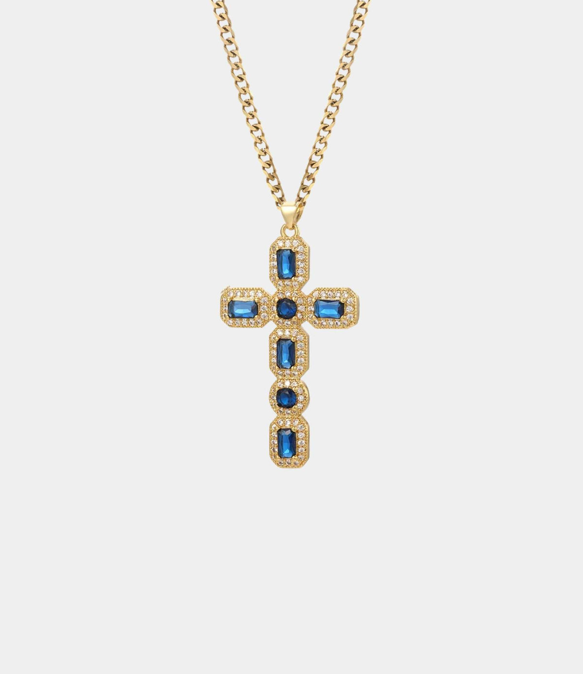 BLYTHE CROSS NECKLACE with a gold-tone chain and blue rectangular stones in a gem-studded cross pendant.