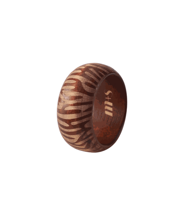 Savannah Wood Bangle in warm auburn wood with bold cream zebra stripes and a chunky rounded shape