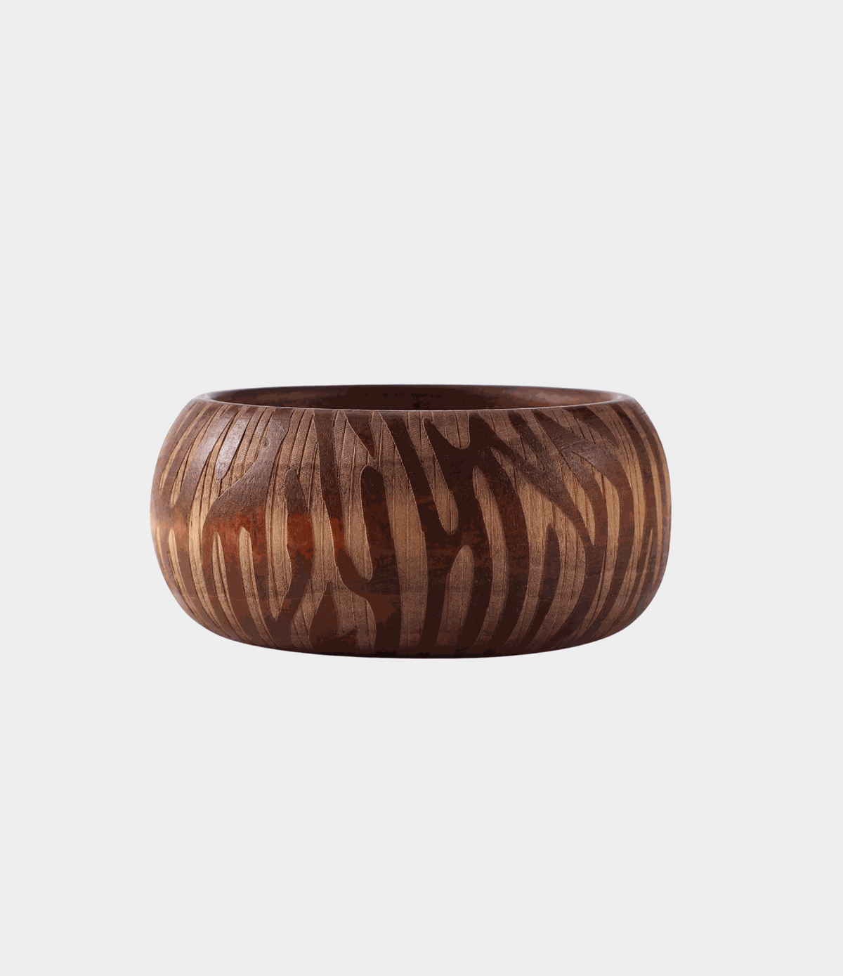 Savannah Wood Bangle in chunky auburn wood with a bold, contrasting zebra stripe pattern and rounded shape
