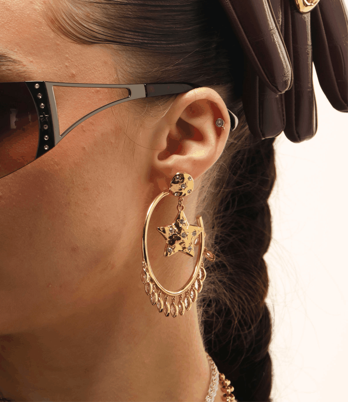 VIVIAN EARRINGS IN PINK gold-tone oversized hoop earring with a star-shaped gem and dangling teardrop details