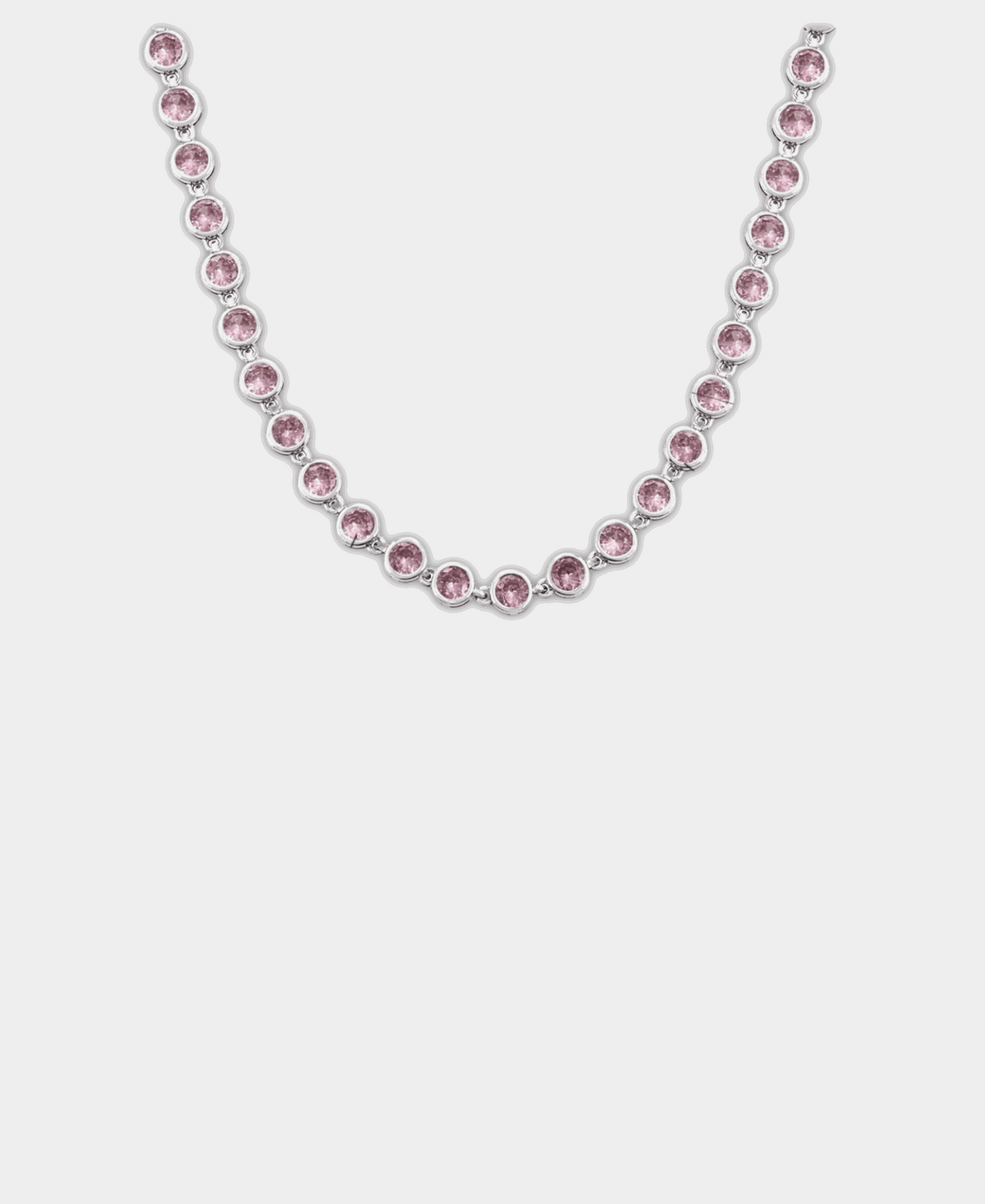 Vivian Tennis Necklace in Pink with a silver-tone setting and a continuous row of round pale pink stones