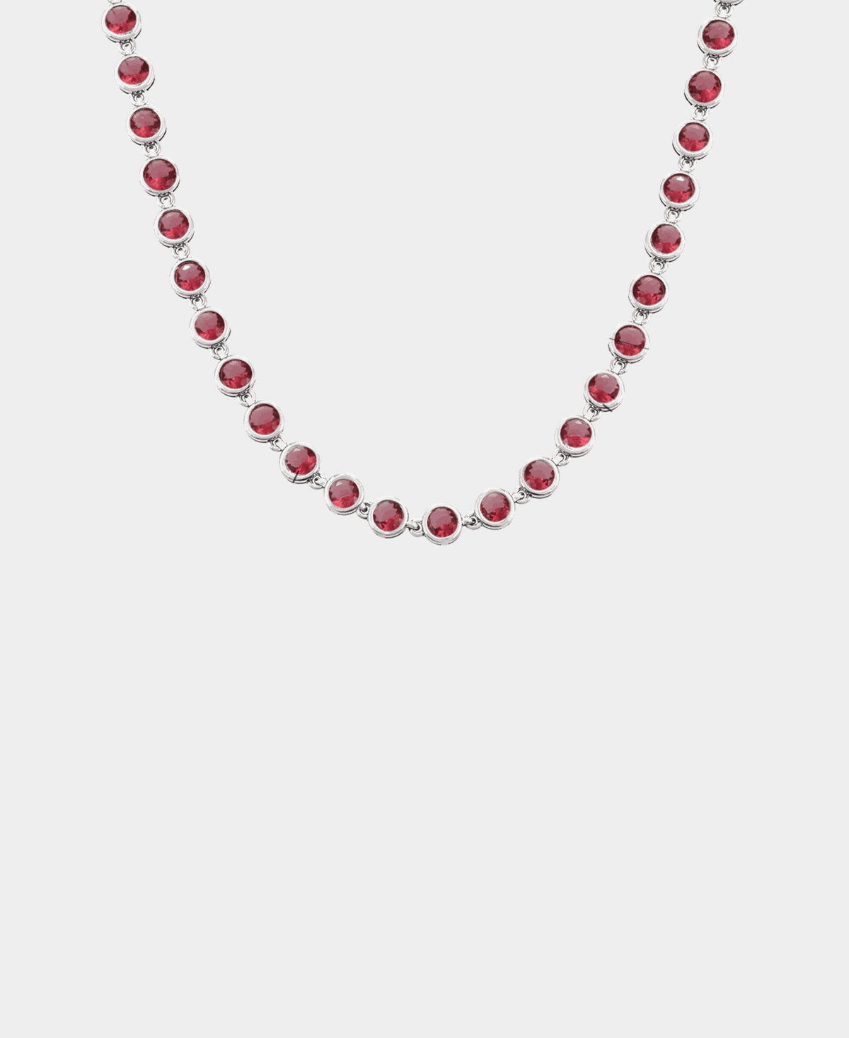 VIVIAN TENNIS NECKLACE with a single row of round red stones in polished silver-tone settings