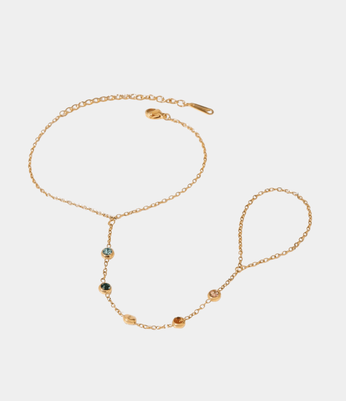 ADA BRACELET gold-tone metal hand-chain bracelet with delicate linked chain and small multicoloured stones, connecting to a finger ring.
