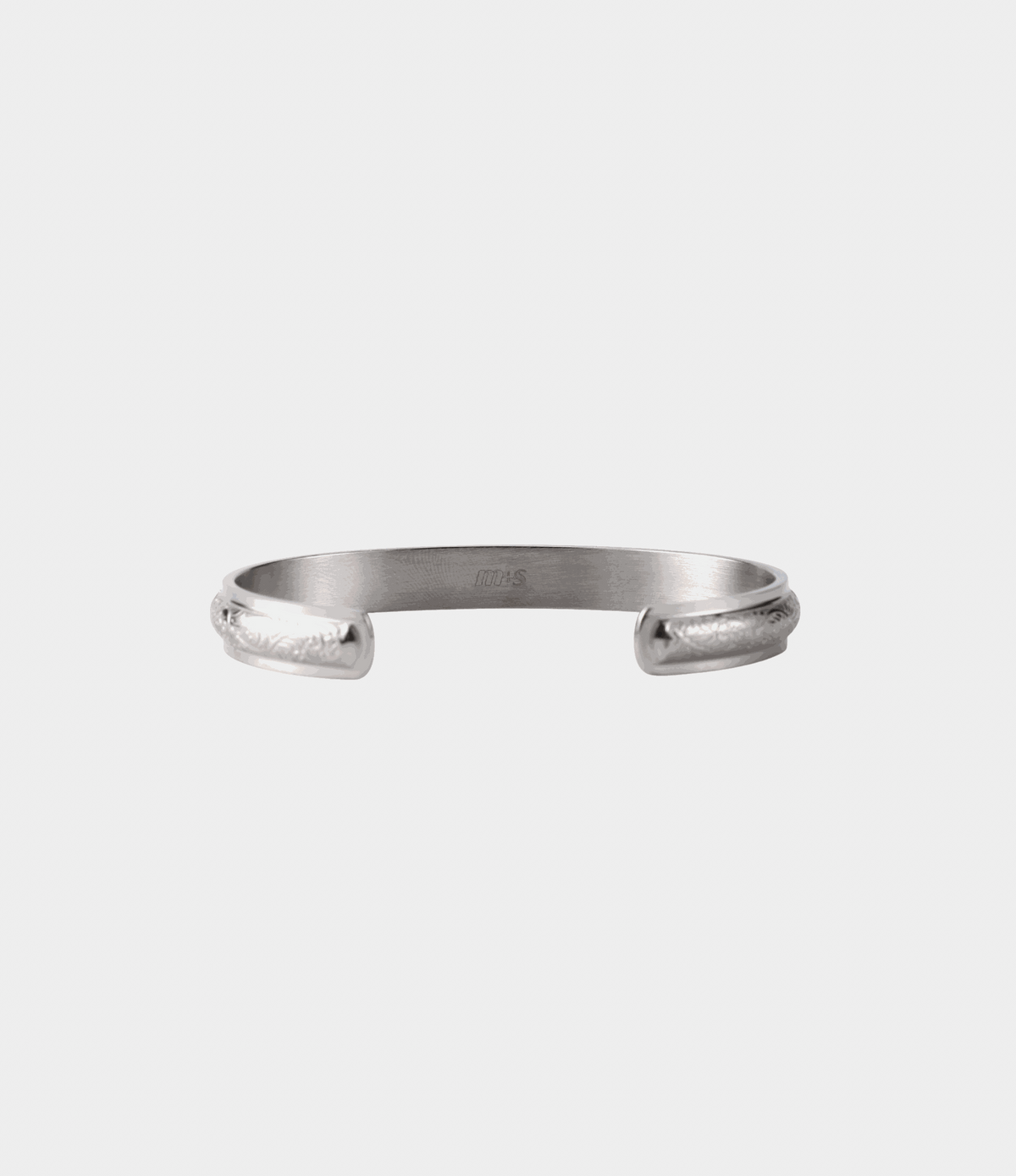 Adeline Bangle - Stainless steel bangle in silver-tone metal, with an open cuff and engraved curved ends.
