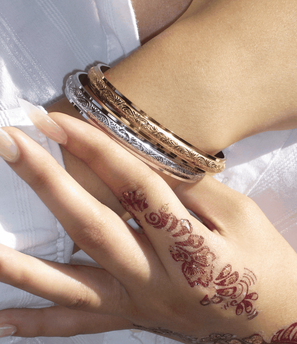 Adeline Bangle - Stainless steel bangle, engraved open cuffs in silver and warm gold tones worn stacked on the wrist