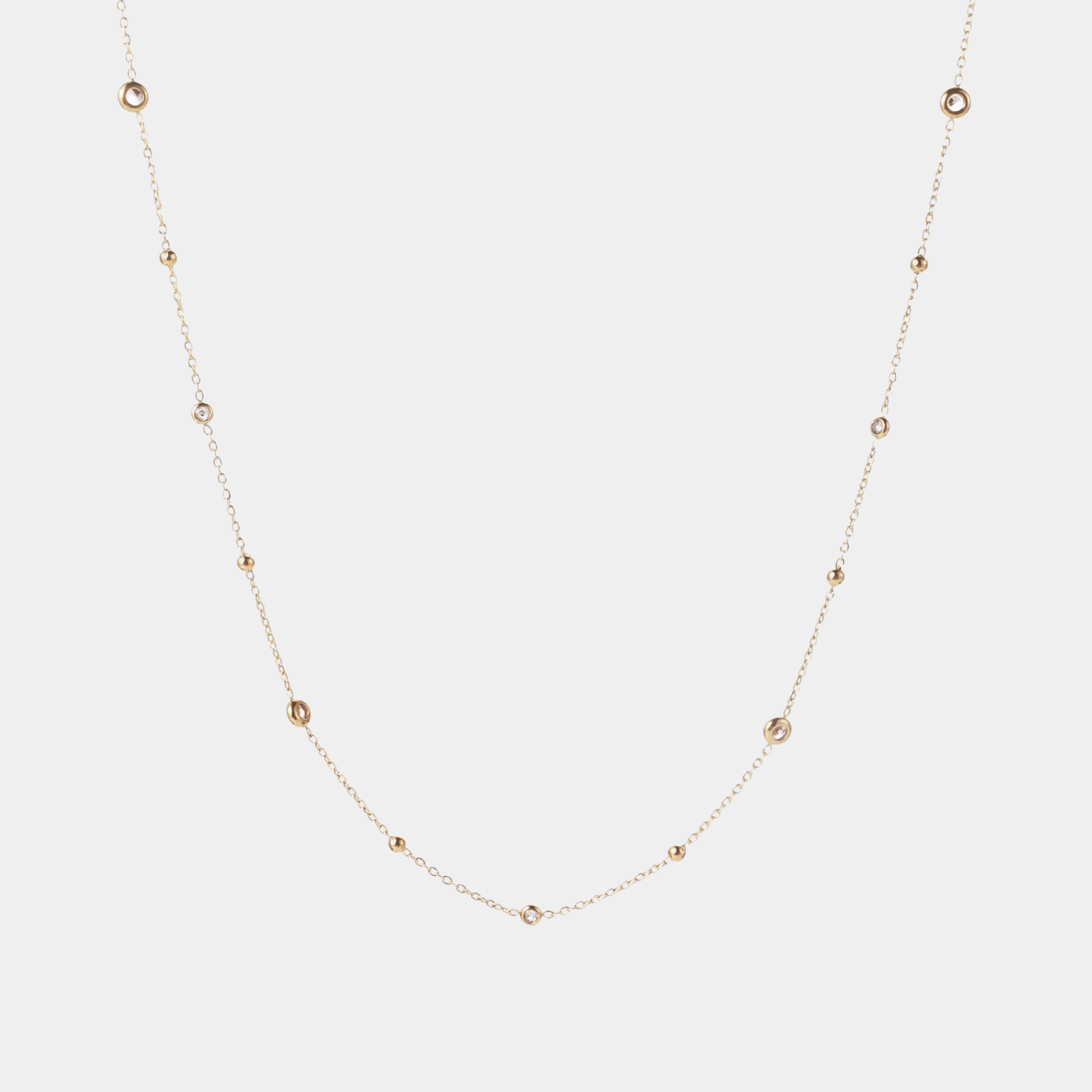 Angelina Waist Chain - PVD plated stainless steel and pink zirconia, gold-tone delicate chain with spaced round stones.