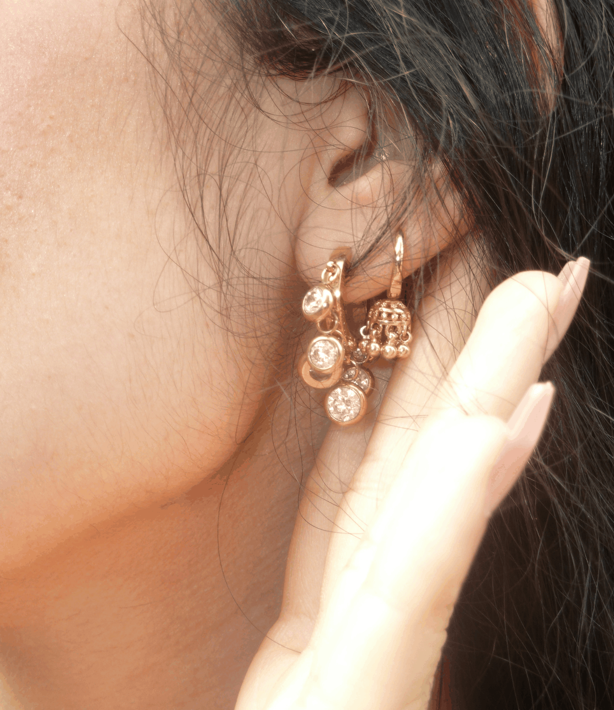 Aurora Hoops in White, gold-tone hoop earrings with clustered round white charms and sparkling textured details.