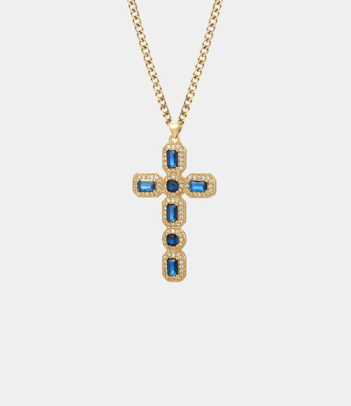 Blythe Cross Necklace in Blue featuring a gold-tone chain and cross pendant set with blue stones and clear accents