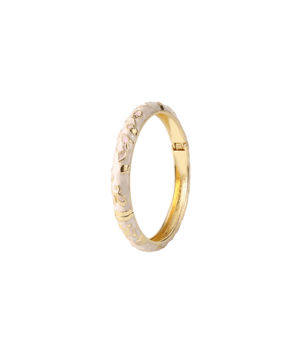 Enamel and gold-tone bangle, DAHLIA BANGLE IN MAGNOLIA, with pale pink floral motifs and a hinged clasp.