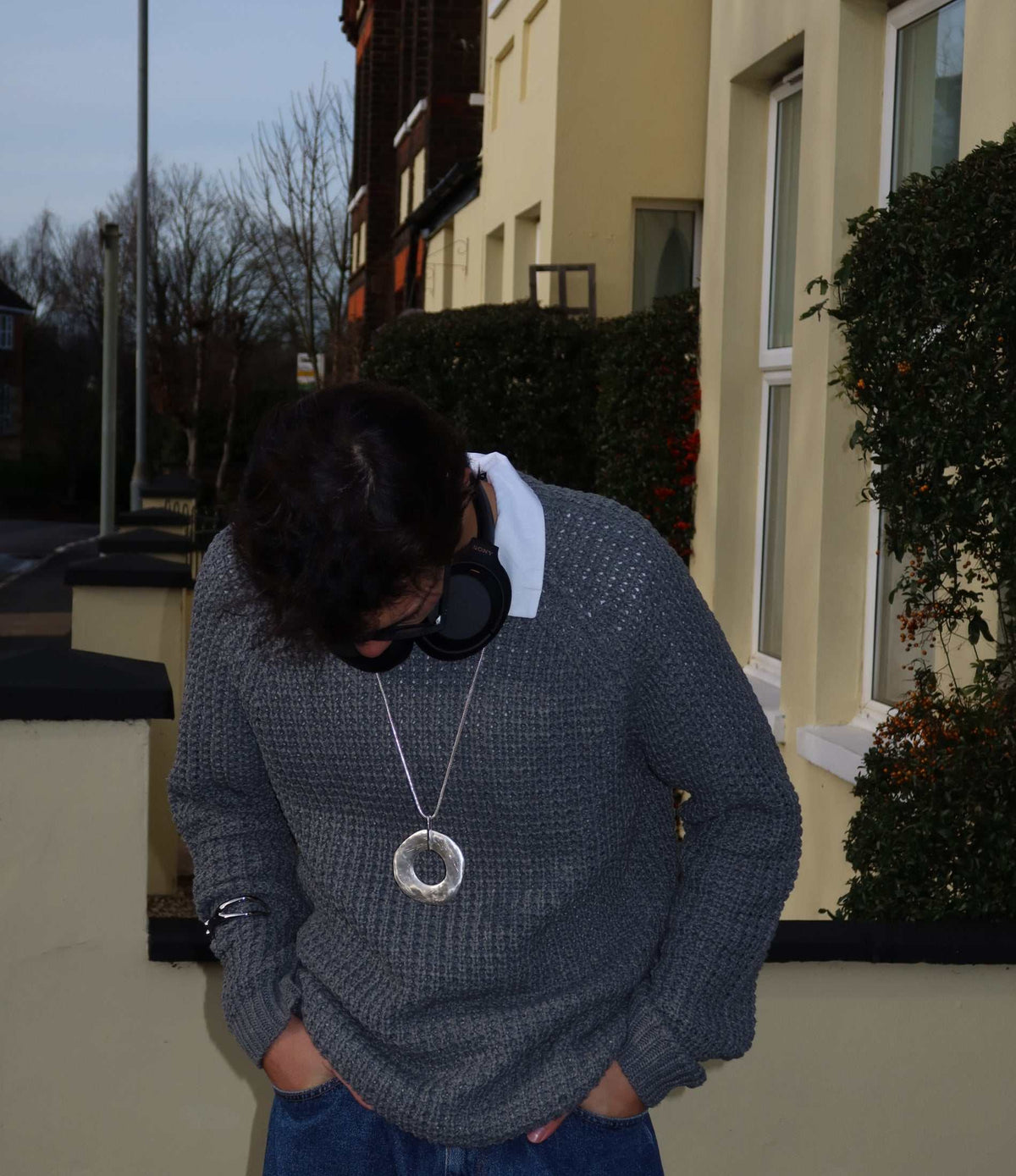 DELILAH PENDANT NECKLACE in silver-tone metal with a long fine chain and large round textured pendant