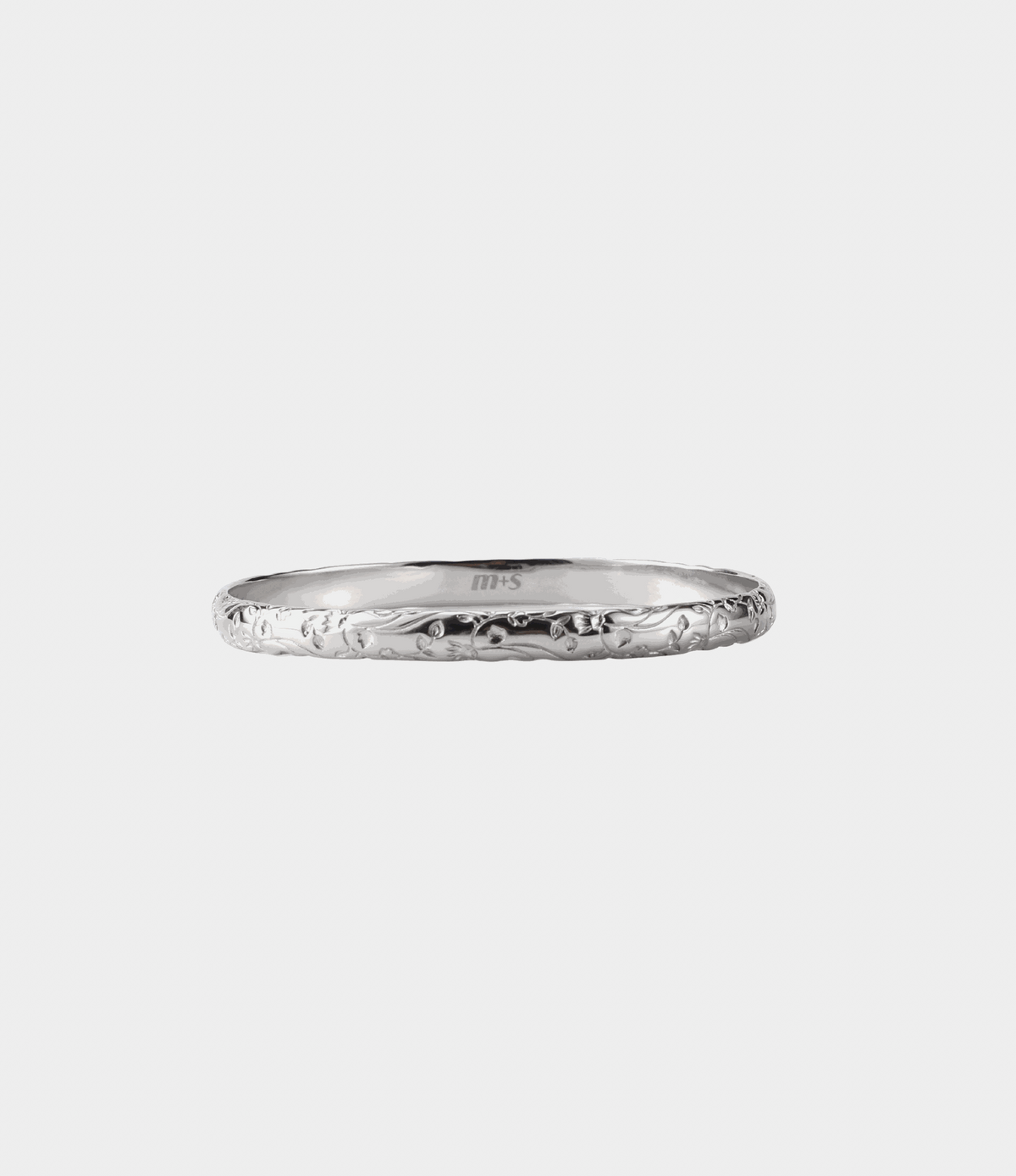 EDEN BANGLE - Stainless Steel Bangle in silver-tone steel with delicate engraved floral pattern around the band.