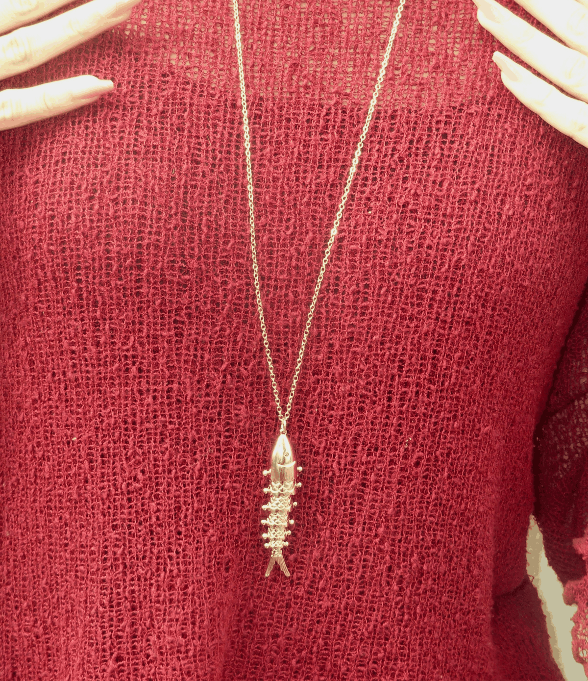 FIONA FISH NECKLACE with a slim gold-tone chain and elongated fish pendant featuring sparkling details