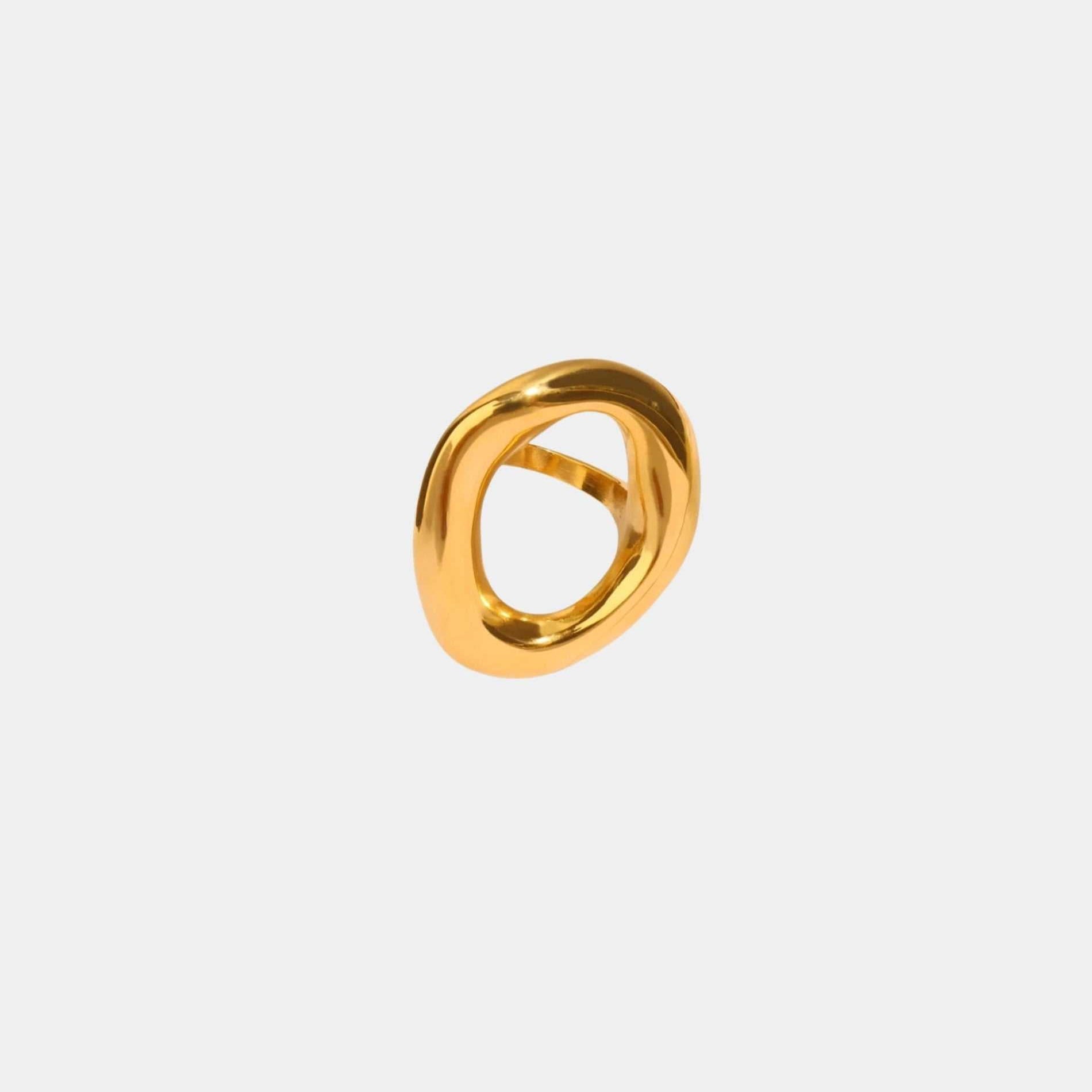 Gilded Gala Ring with a polished gold-tone finish, featuring a bold sculptural loop and open center.