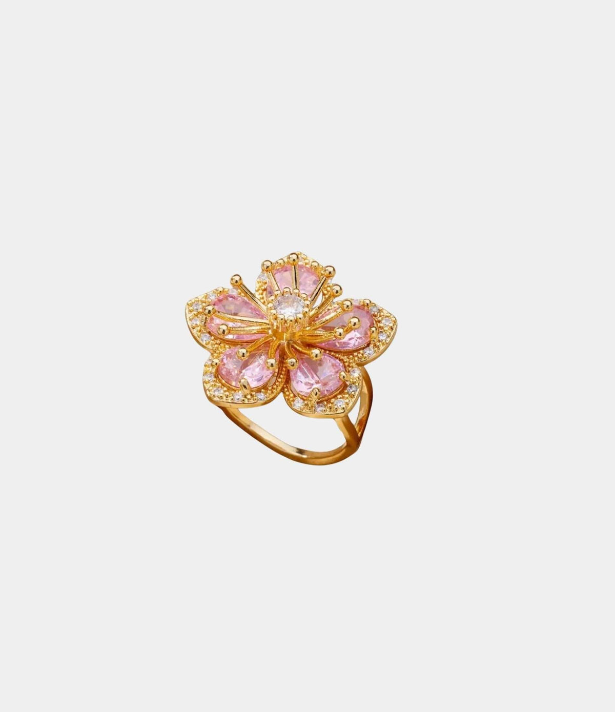 LOVELA RING IN PINK, gold-tone statement ring with a pink jeweled flower and sparkling petal accents