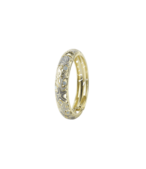 MERMAIDIA BANGLE IN GRAY, gold-tone metal bangle with pale gray enamel, featuring an ornate floral cutout pattern