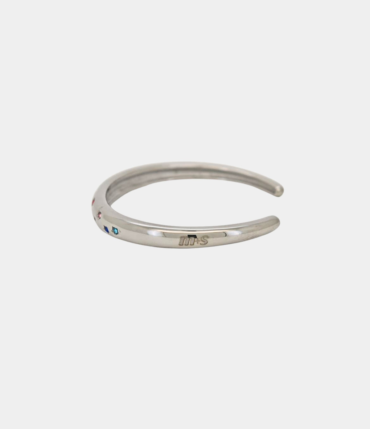 Olivia Bangle in Multicolour, a silver-toned open bangle with small colourful gem accents and a smooth metal band