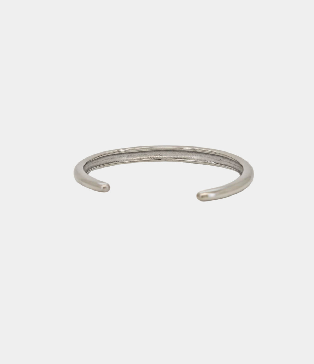 Olivia Bangle in Multicolour is a slim silver-toned metal open cuff with a smooth, plain finish and rounded ends.