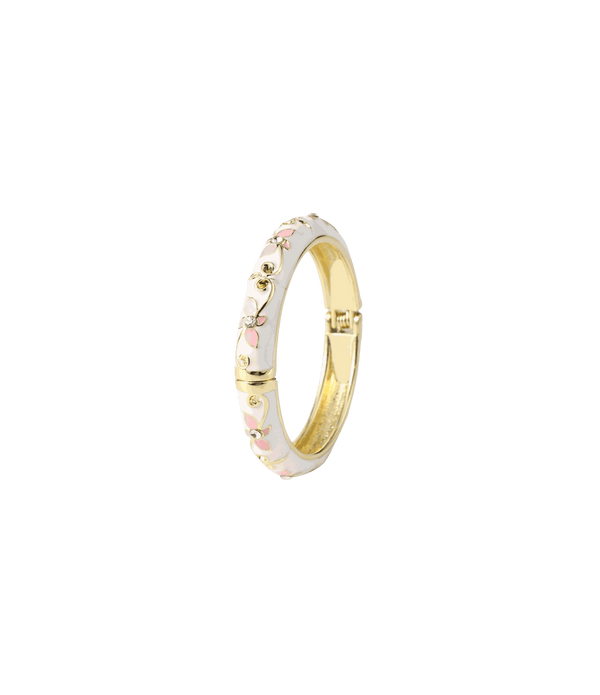 PETIT FLEUR BANGLE in white enamel with a gold-tone metal band, decorated with delicate pink flowers and gold accents.