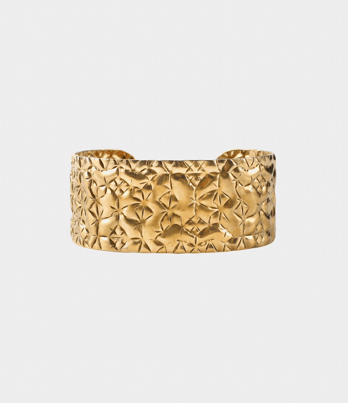 Soleil Bangle - Stainless steel bangle in gold-tone metal with a wide cuff and raised crinkled, starburst texture