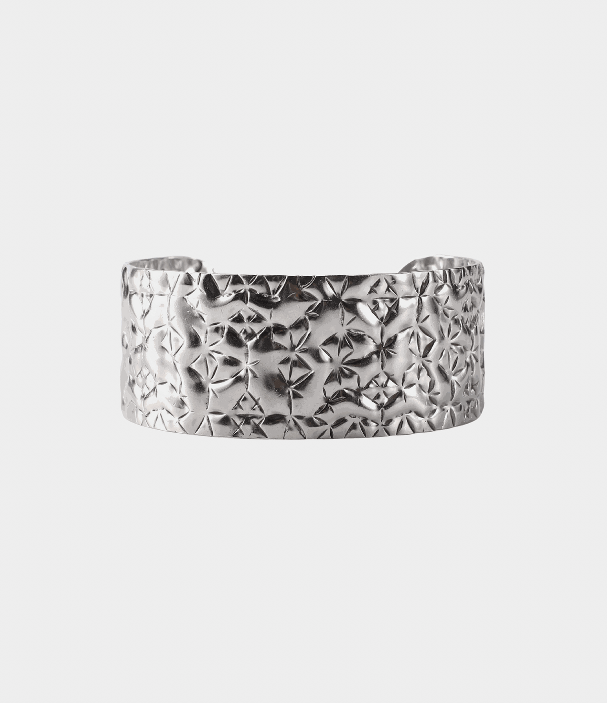 Soleil Bangle - Stainless steel bangle in silver with a wide open cuff and deeply crinkled, faceted texture.