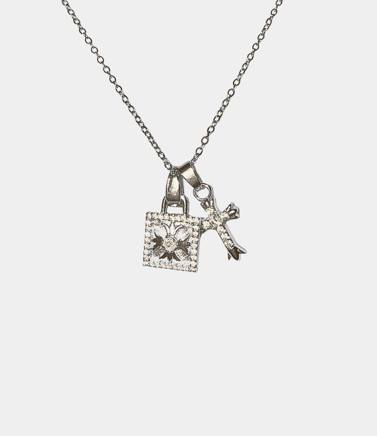 SOPHIA NECKLACE in silver-tone metal with a delicate chain and sparkling floral and key charms