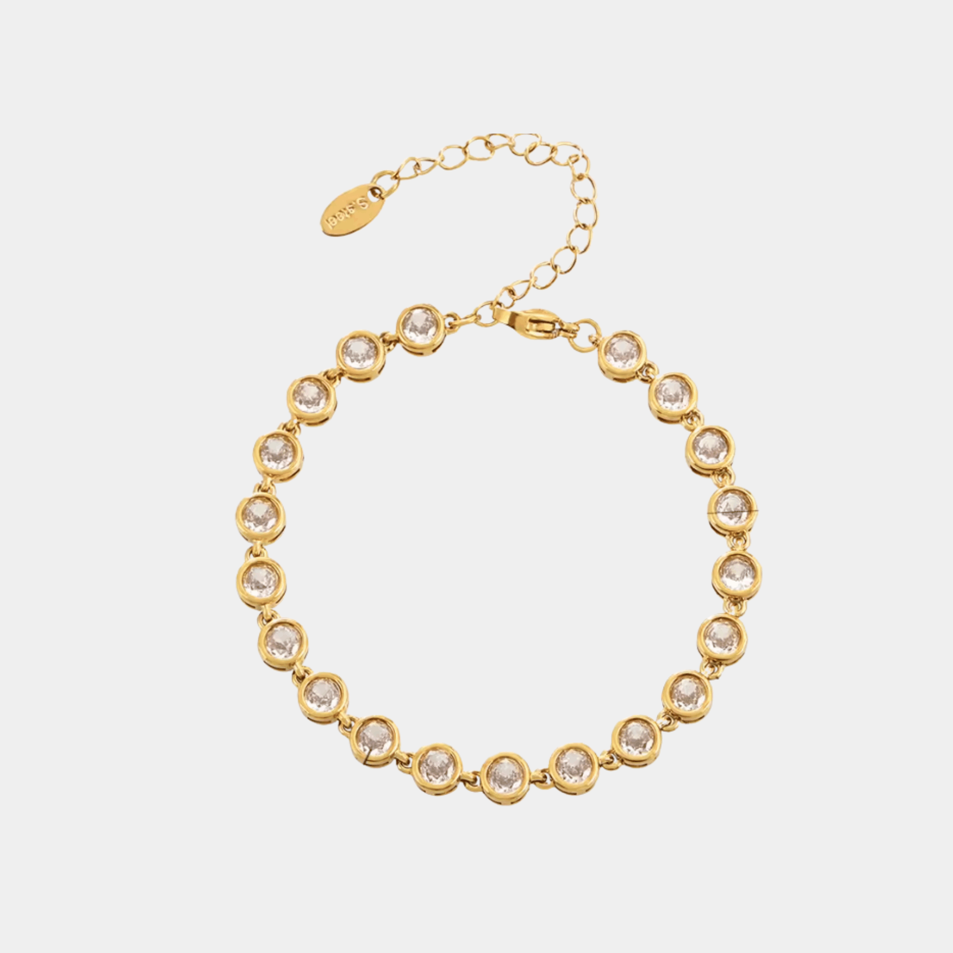 VIVIAN BRACELET IN WHITE, gold-tone metal bracelet with a single row of round clear stones in bezel settings and an extender chain.