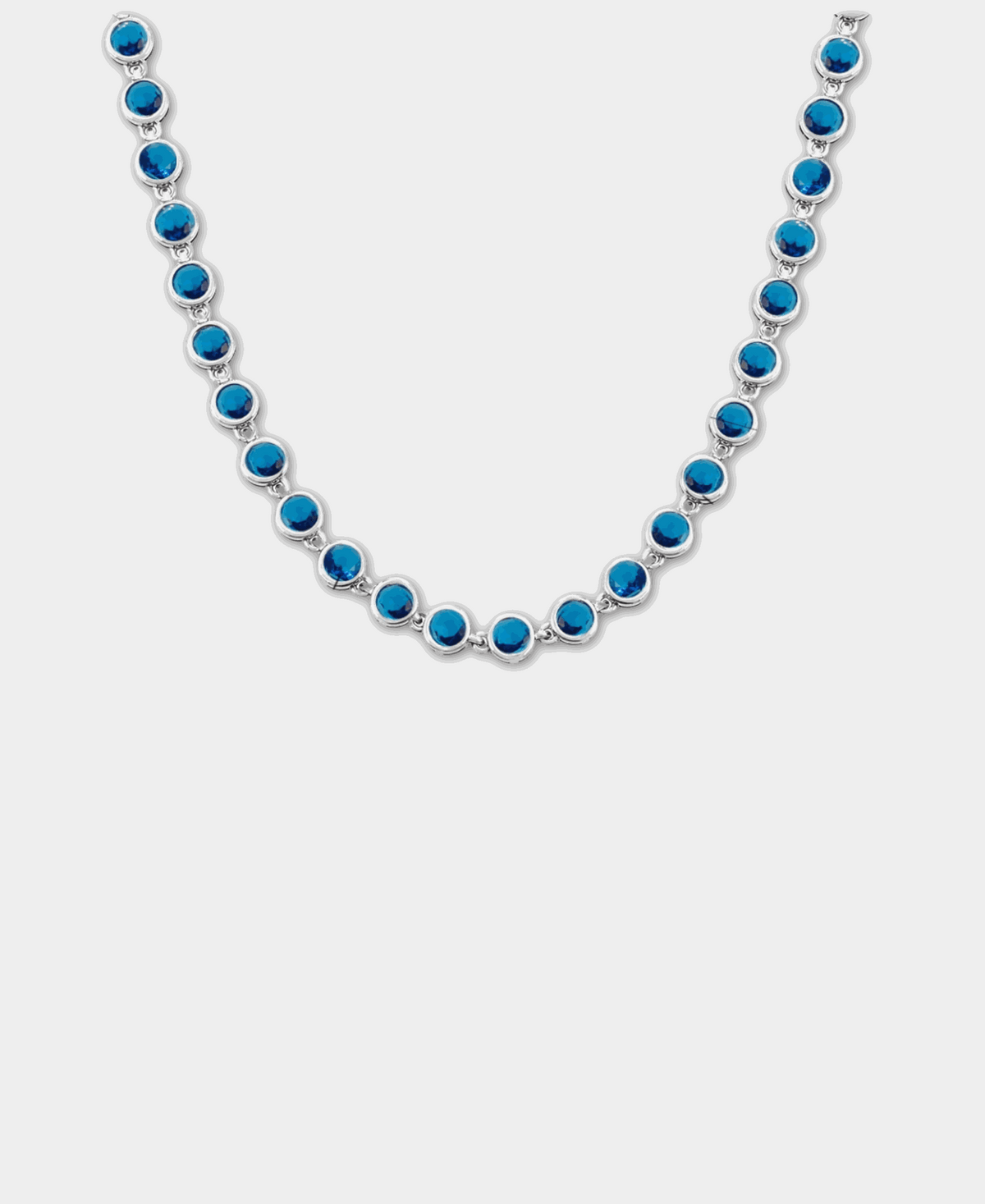 VIVIAN TENNIS NECKLACE with vivid blue round stones in silver-tone settings, arranged in a delicate linked row