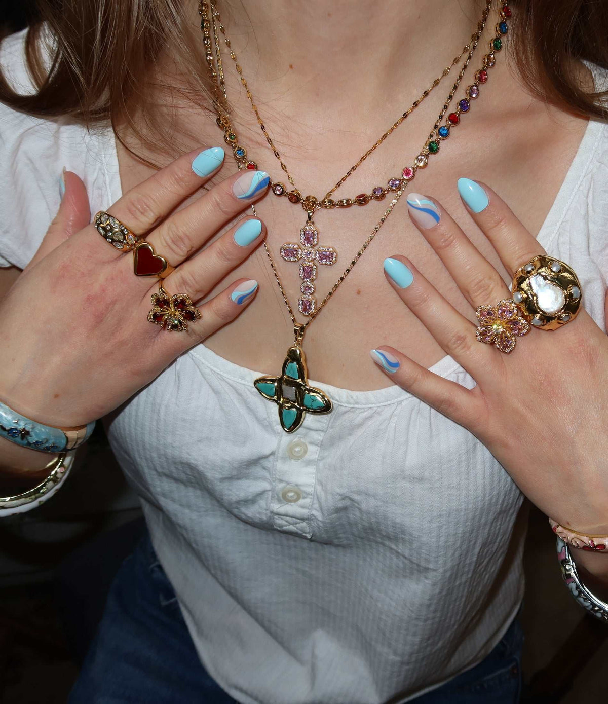 VIVIAN TENNIS NECKLACE with multicolour stones set along a delicate gold-tone chain, worn as a sparkling layered piece.